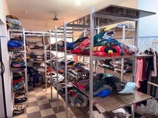 Clothing sorted and displayed in the GAMAID Garments showroom