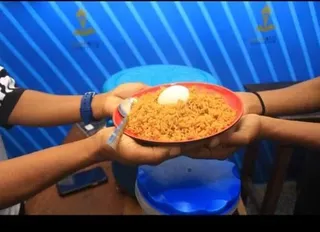 A meal being served at the GAMAID Kitchen in Uyo