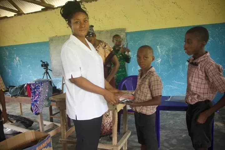 Pupils receiving clothing from GAMAID Garments