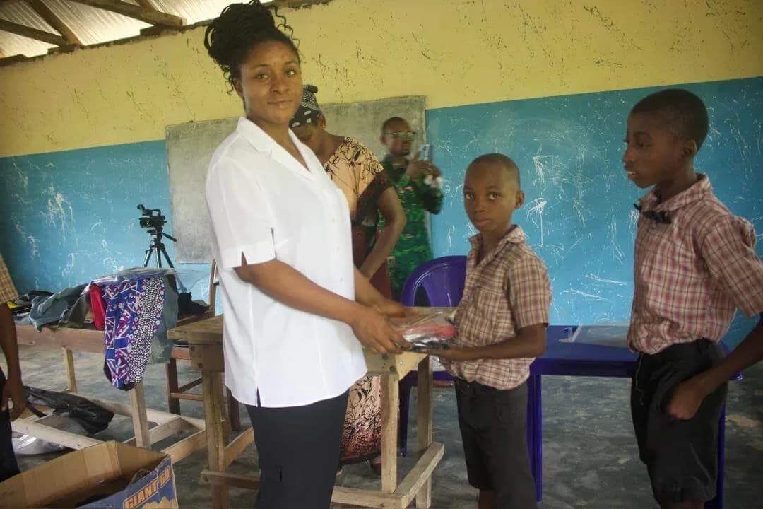 Pupils receiving clothing from GAMAID Garments