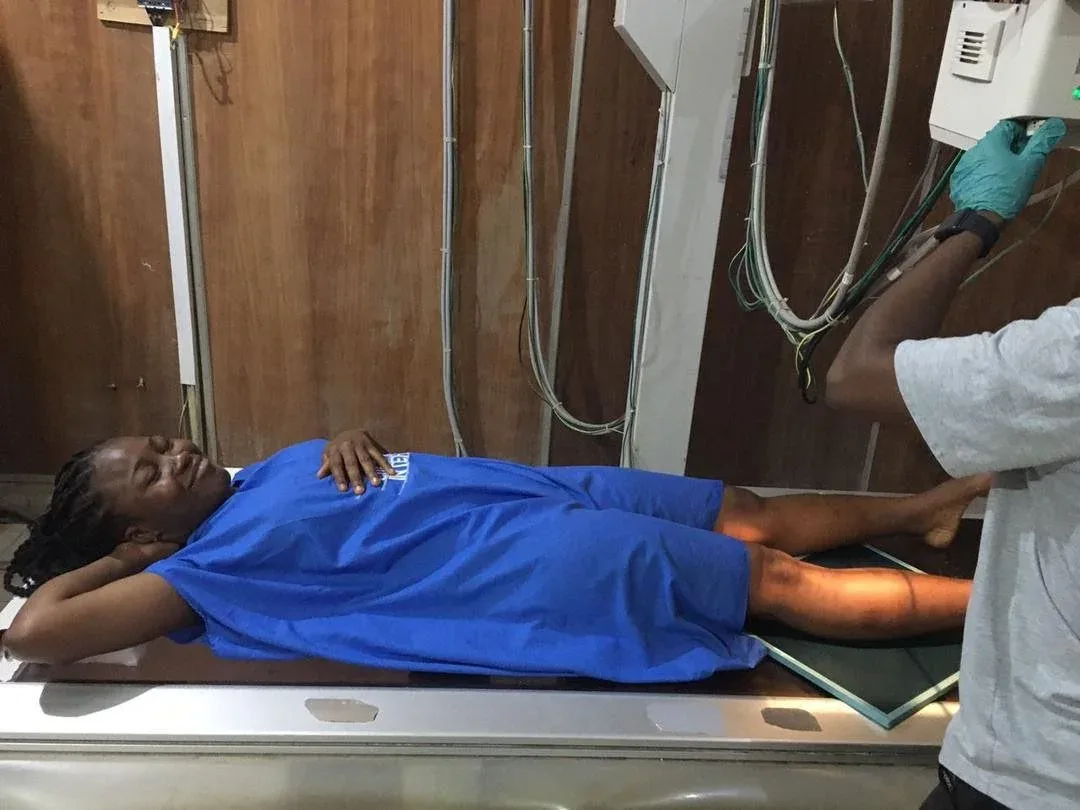 GAMAID staff with a patient receiving medical care