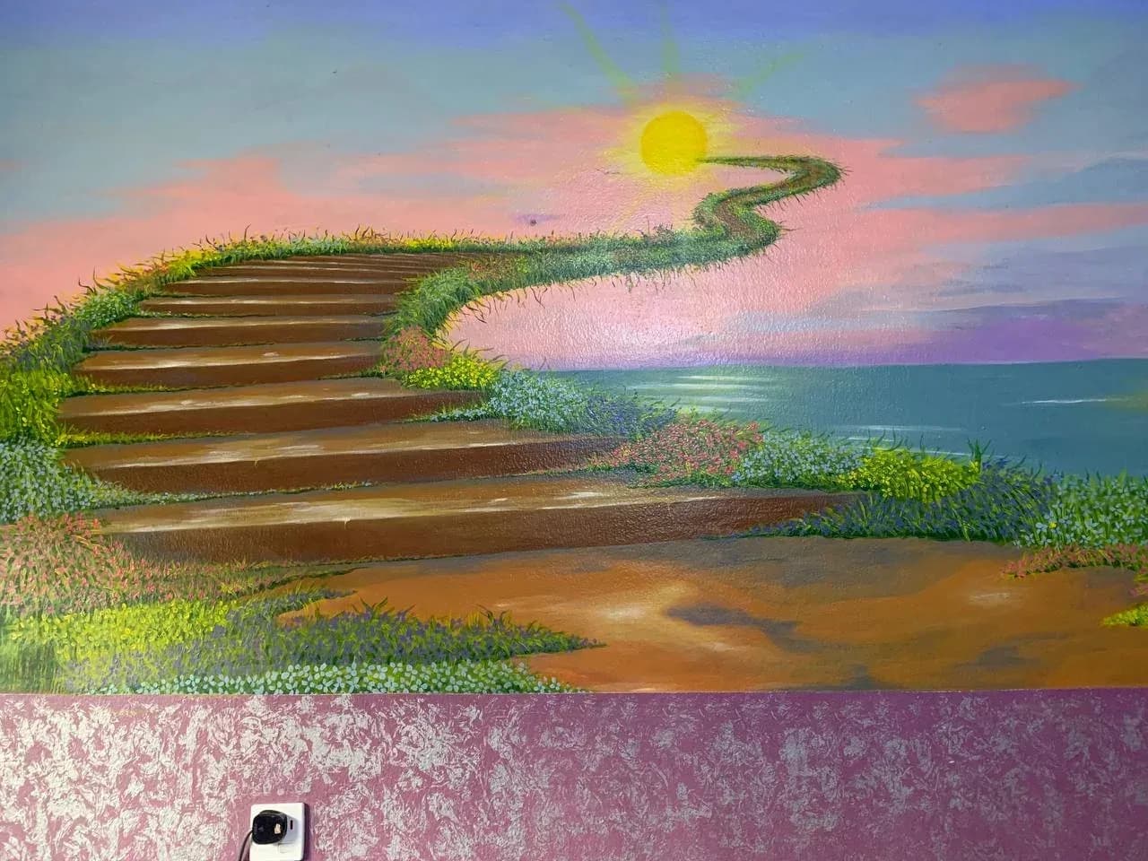 A painted mural inside a GAMAID Family house