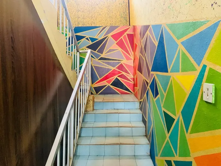 A painted stairwell in a GAMAID Family house