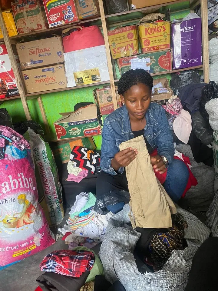 Sorting donated clothing at GAMAID Garments
