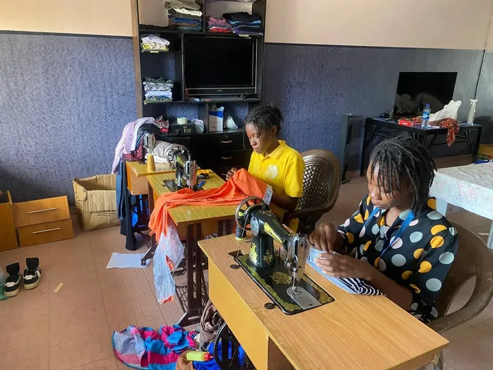 Trainees at work in the GAMAID tailoring class