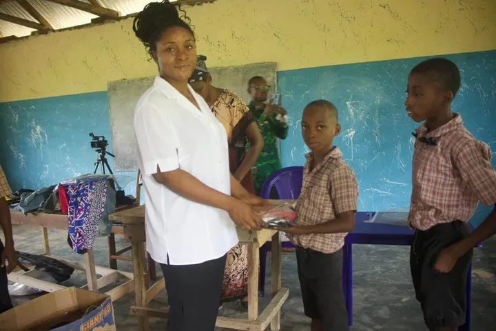 Pupils receiving clothing from GAMAID Garments